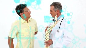 Doctor explaining spine model to patient, medical data animation over them. Healthcare, consultation, anatomy, treatment, diagnostics, education - Powered by Shutterstock - Get 15% off with code: PIKWIZARD15