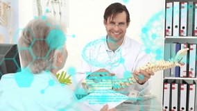 Doctor holding spine model, explaining to patient, medical data animation over scene. Healthcare, orthopedics, consultation, anatomy, diagnosis, education - Powered by Shutterstock - Get 15% off with code: PIKWIZARD15