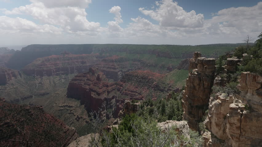 Top view of Grand Canyon during hike. Green cliffs and red canyon. Arizona, USA.