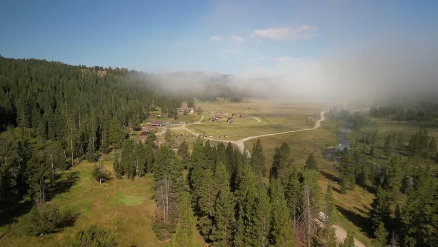 Aerial of horse ranch hotel in Montana Madison range in summer
