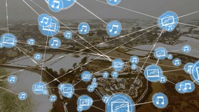 Music and media icons connected by lines animation over aerial view of snowy town. Technology, connectivity, communication, network, concepts, winter - Powered by Shutterstock - Get 15% off with code: PIKWIZARD15
