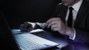 Interacting with a laptop and a simulated holographic panel. - Powered by Shutterstock - Get 15% off with code: PIKWIZARD15