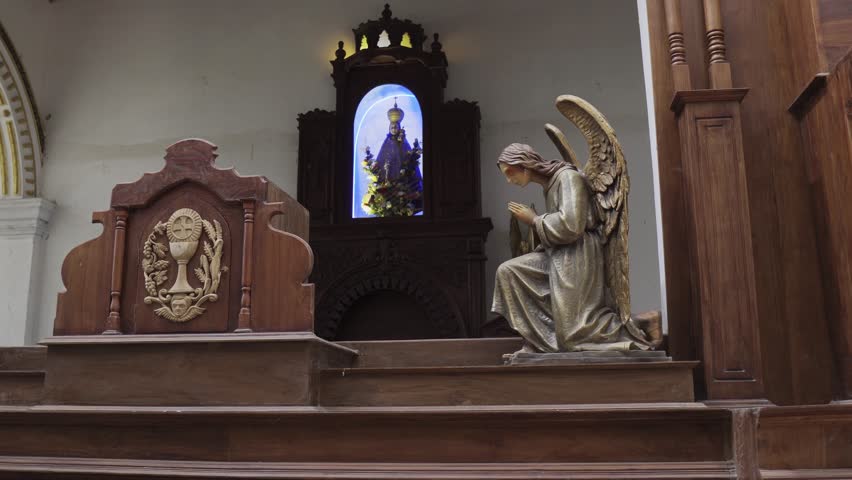 Church interior in Sri Lanka with statues and sculptures
