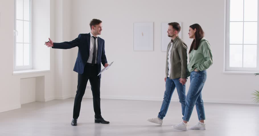 Young couple explores various properties with their realtor each viewing session, representing pivotal moment in quest for ideal apartment journey filled with anticipation excitement what lies ahead