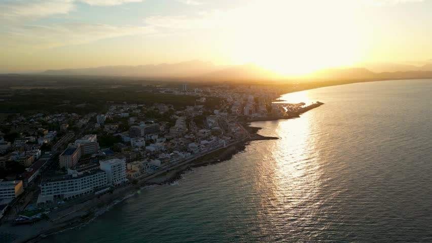 Beautiful nature of Mallorca, sunset over Can Picafort, resorts on the beach, 4k