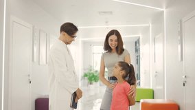 Consultation between a doctor, child, and parent in a welcoming modern medical office that prioritizes family care and wellbeing - Powered by Shutterstock - Get 15% off with code: PIKWIZARD15