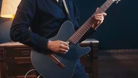 Guitar player, guitarist is performing live on stage with an electric guitar in a concert setting, music playing, live concert show, close up macro of guitar. - Powered by Shutterstock - Get 15% off with code: PIKWIZARD15