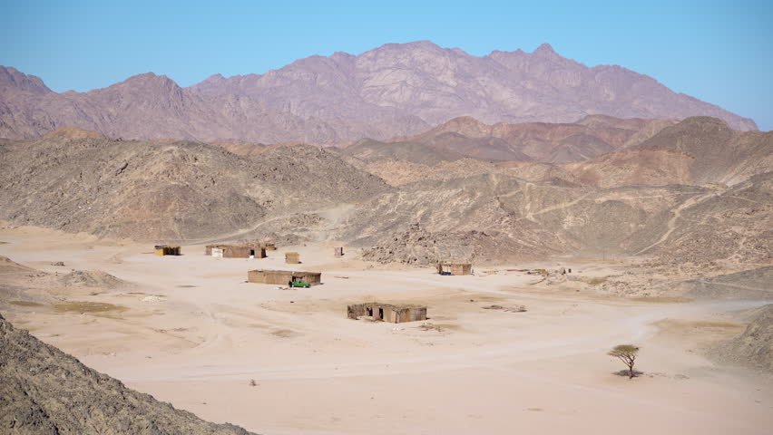 A small Bedouin village in the desert between the mountains from above, Egypt