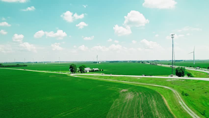 Aerial view of Meadow Lake Wind Farm in Indiana, USA, capturing the vast expanse of wind turbines harnessing renewable energy across the rural landscape.