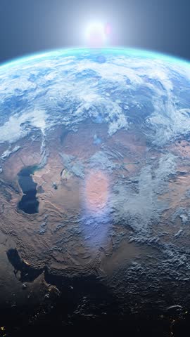 Dawn, the sun rises behind the planet earth. Sunrise over the globe. Top view from the space. Day to night transition, great for the news or climatic change concept. Spacescape background, vertical