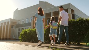 Father mother child school little child holds parents hands arriving school little child kid girl daughter Holds father mother hand, Parents child background school building little first grader goes - Powered by Shutterstock - Get 15% off with code: PIKWIZARD15