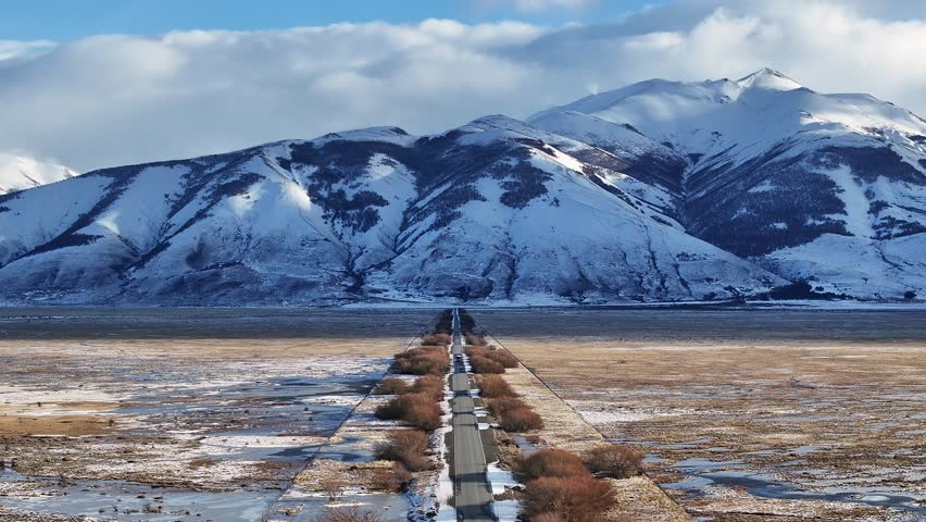 Patagonia Road At El Calafate In Santa Cruz Argentina. Snowy Mountains. Road Trip Scenery. Santa Cruz Argentina. Winter Travel. Patagonia Road At El Calafate In Santa Cruz Argentina.
