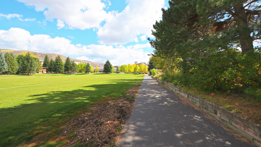 Avon Colorado small town Nottingham park pov point of view walking, people sunbathing on sunny autumn fall day
