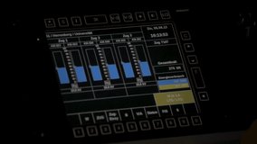 Train control panel illuminated in a dim setting, showing various gauges and controls - Powered by Shutterstock - Get 15% off with code: PIKWIZARD15