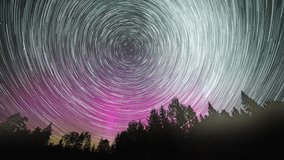 Star trails time lapse with beautiful northern lights. Aurora borealis and star trails. - Powered by Shutterstock - Get 15% off with code: PIKWIZARD15