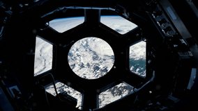 Planet Earth Seen Through the Window of the International Space Station. Elements of this Video furnished by NASA - 4K Resolution - Powered by Shutterstock - Get 15% off with code: PIKWIZARD15