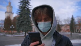Young Man wearing Protective Face Mask use phone COVID-19 coronavirus infection pandemic disease virus male tourist epidemic air health - Powered by Shutterstock - Get 15% off with code: PIKWIZARD15