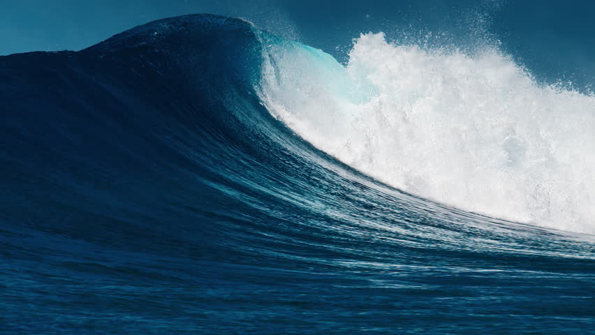 Perfect ocean wave rolls and breaks in the Maldives