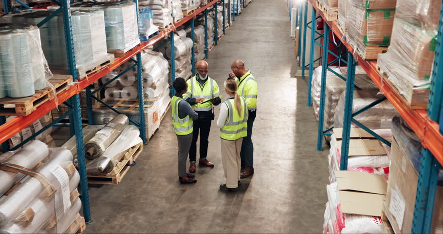 People, meeting or supervisor on tablet in factory for shipping distribution, order or supply chain. Warehouse training, plant or above of logistics boss talking to team organize delivery inventory