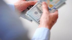 Male hands counting US Dollar bills, close-up - Powered by Shutterstock - Get 15% off with code: PIKWIZARD15