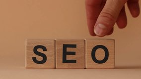 Wooden blocks with SEO inscription, Hand changing the block with the letter O to M. SEO and SEM. Copy space - Powered by Shutterstock - Get 15% off with code: PIKWIZARD15
