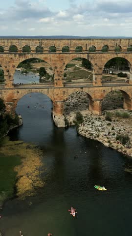 Aerial view of beautiful Pont du Gard, the famous Roman aqueduct bridge of Nimes, France, vertical video
