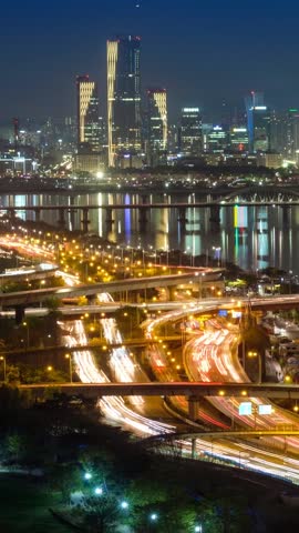 Aerial timelapse of Seoul downtown cityscape and Seongsan bridge over Han River in twilight. Seoul, South Korea.