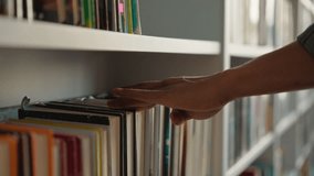 Close up hand African American man choose book bookshelf library bookstore student university unrecognizable reader literature textbooks literary bookworm bookcase education learn buyer shopper books - Powered by Shutterstock - Get 15% off with code: PIKWIZARD15