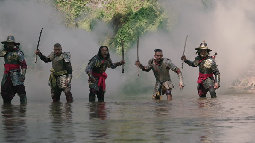 Thai soldier with ancient armor suit fighting and running in the river