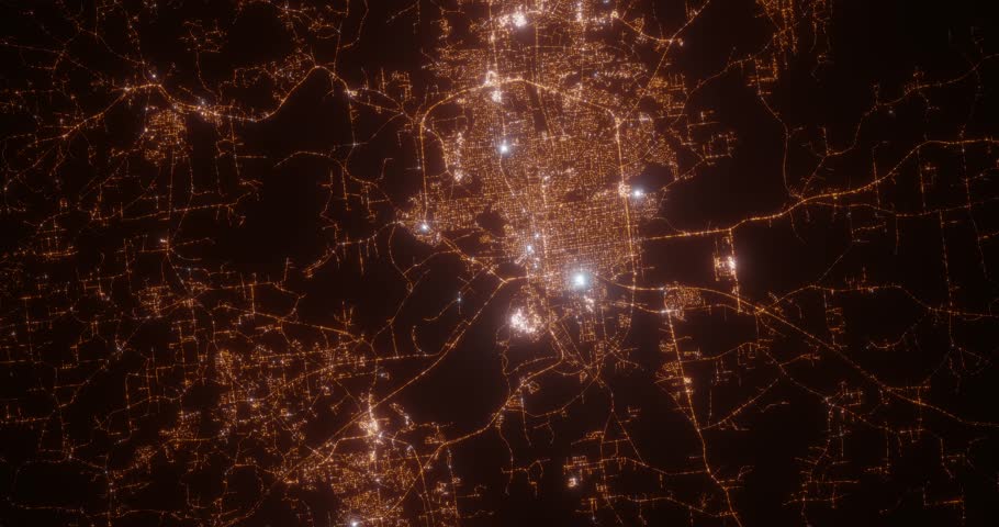 Montgomery (Alabama, USA) aerial view at night. Top view on modern city with street lights. Camera is zooming out, rotating counterclockwise. Vertical video. The north is on the left side
