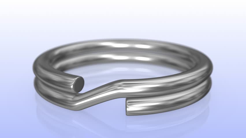 Silver Textured 3D Key Ring on a Reflective Floor. Camera Focus on Ring. 4K - Powered by Shutterstock - Get 15% off with code: PIKWIZARD15