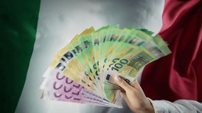 Italian flag background. Woman with cash money euros. Credits, raising tariffs in EU Europe, Italy traveling costs, financial concept. - Powered by Shutterstock - Get 15% off with code: PIKWIZARD15