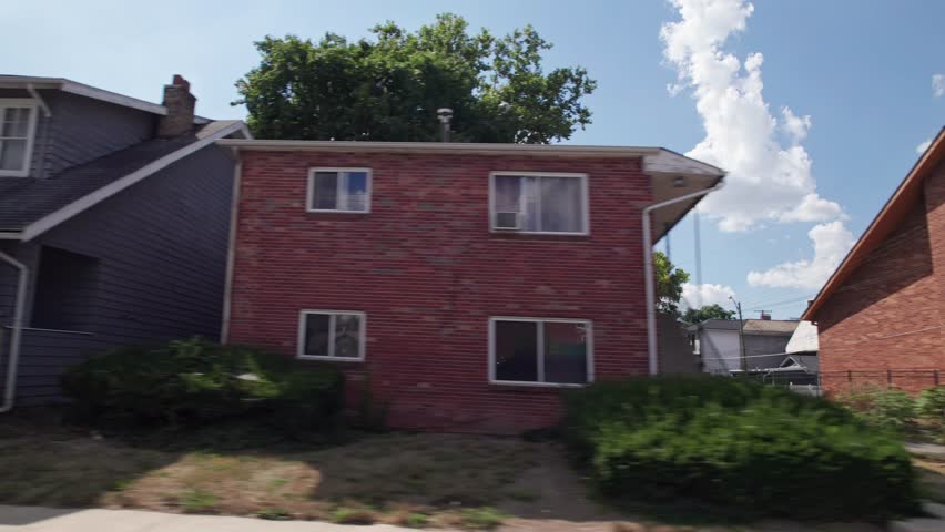 City and townhouses housing and residential homes on outskirts of downtown center of Columbus, Ohio in the midwest part of the United States in a low income and middle class suburb and neighborhood