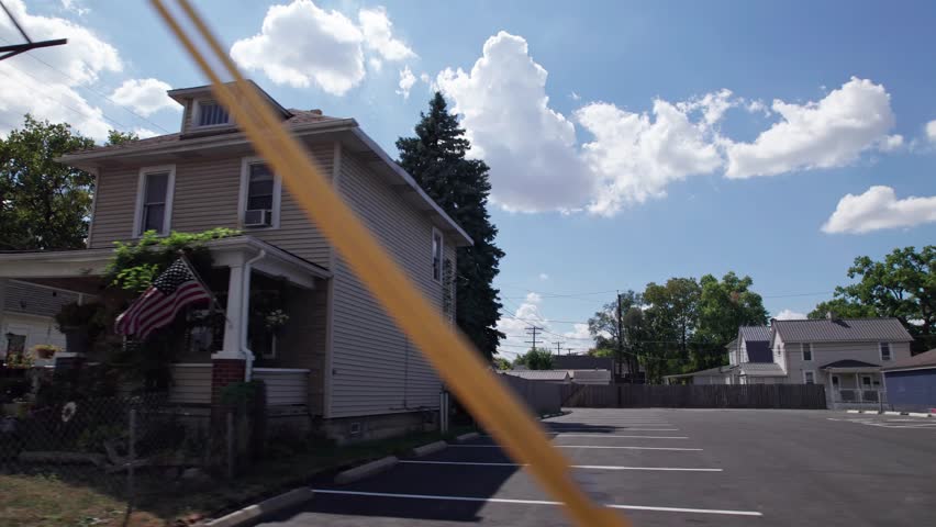 City and townhouses housing and residential homes on outskirts of downtown center of Columbus, Ohio in the midwest part of the United States in a low income and middle class suburb and neighborhood