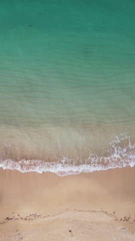 Phuket Thailand tropical beach Aerial drone top down view bird eye view of sea blue waves break on rock and sand. Turquoise ocean calm water and soft sand beach. tropical exotic Fiji island. Summer