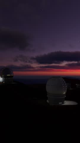 3D - Aerial view rotating circularly at sunset of the Mauna Kea observatory in Hawaii. United States of America