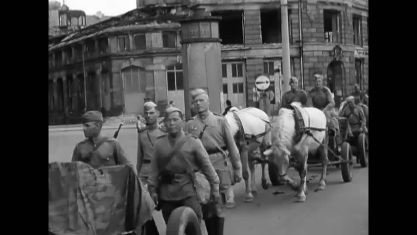 Leipzig - 1945 - russian soldiers march with horse-drawn vehicles through the streets of leipzig, germany.