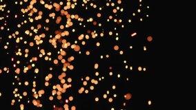 Slow motion hot sparks slowly falling from above black background, 180fps - Powered by Shutterstock - Get 15% off with code: PIKWIZARD15