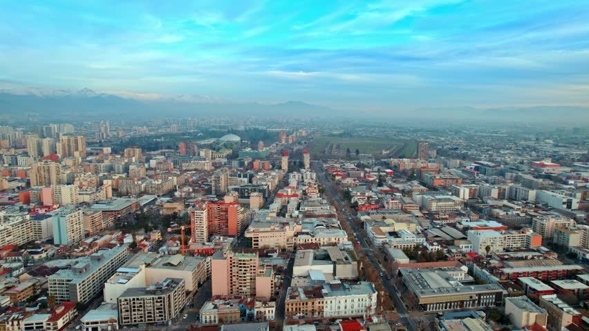 Aerial cityscape of Santiago de Chile Republica Neighborhood at daylight urban buildings with andean cordillera background around Alameda avenue