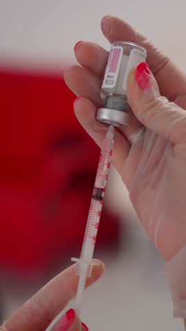 Filling syringe with drug. Concept of medicine for injection.