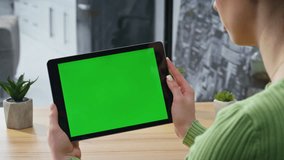 Businesswoman video calling mockup tablet in light office closeup. Unrecognizable entrepreneur using horizontal green screen pad device. Woman hands holding chroma key tab computer at modern home - Powered by Shutterstock - Get 15% off with code: PIKWIZARD15