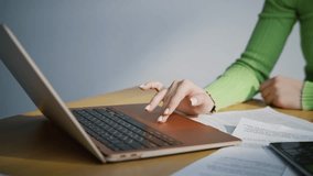 Closeup woman touching computer touchpad typing calculator in office. Manager surfing internet working in cabinet. Unrecognizable accountant writing notes making research. Business lifestyle concept  - Powered by Shutterstock - Get 15% off with code: PIKWIZARD15