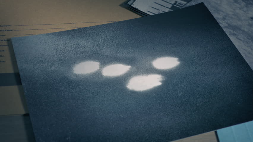 UFO Photo Put On Desk With Classified Folder