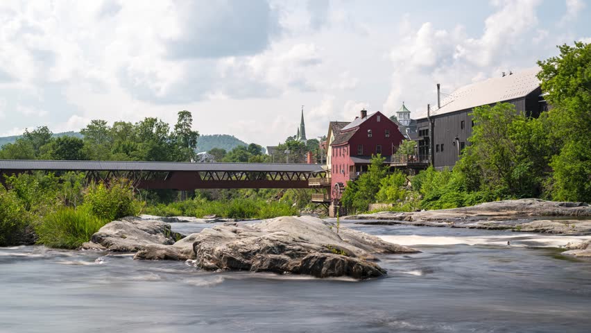 Littleton New Hampshire and the Riverwalk Covered Bridge over the Ammonoosuc River. Long Exposure 4k Time Lapse.