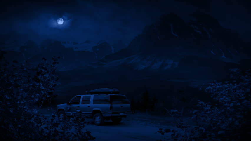 Car On Mountain Road In The Moonlight