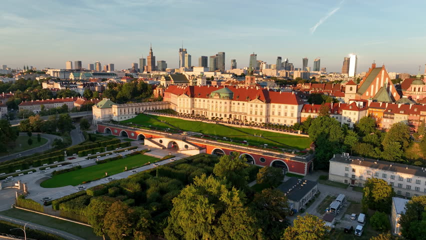 Aerial view of the Warszawa cityscape. Old town and modern skyscrapers at sunrise, Royal Castle. Poland.