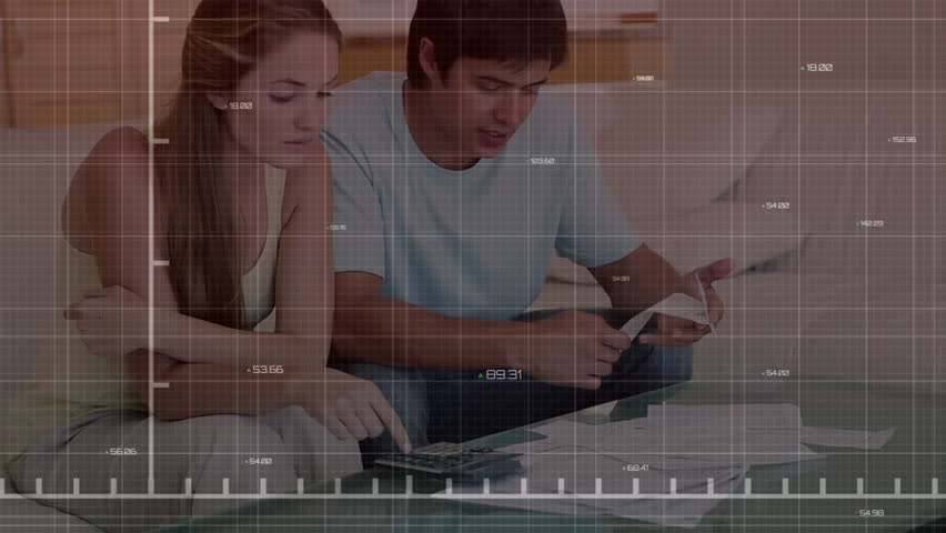 Analyzing financial documents, couple with stock market graph animation over them. Finance, analysis, investment, economy, business, data - Powered by Shutterstock - Get 15% off with code: PIKWIZARD15