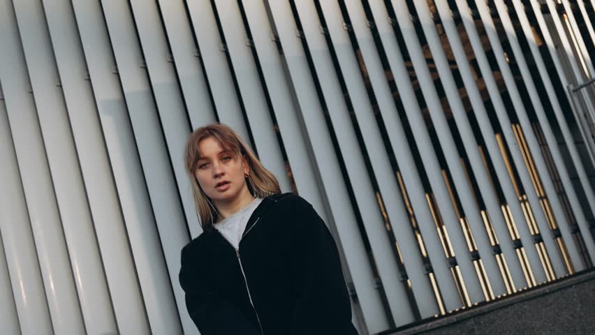 Young woman dancing hip hop on the street.
