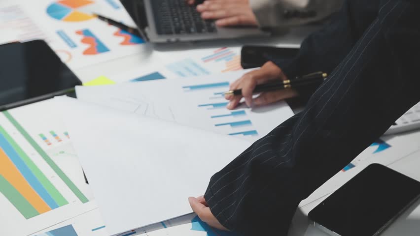 Team of business people are meeting to analyze data for marketing plan,Market research reports and income statistics, Financial and Accounting concept.