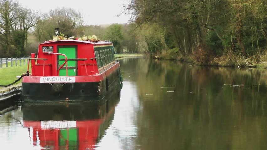 STAFFORD, UK - MARCH 16, 2013: Narrow Boat Moored - with reflections in the
